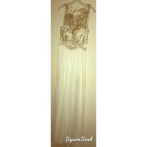 Long white and gold sequence prom dress.